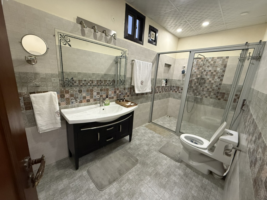 Private en-suite bathroom with glass shower